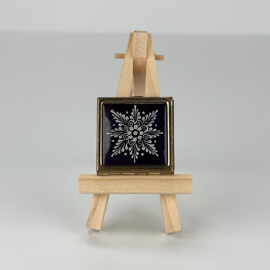 Vintage Pill Box in Gold Tone with Snowflake on a Blue Background