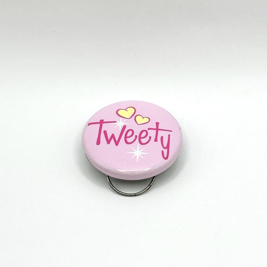 Vintage Clip On Button Reads Tweety on a Pink Background with Yellow Hearts
